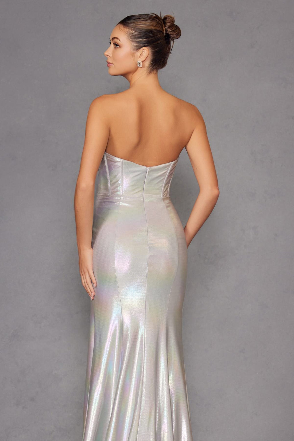 Iridescent strapless sweetheart prom gown in silver satin with open-back corset details