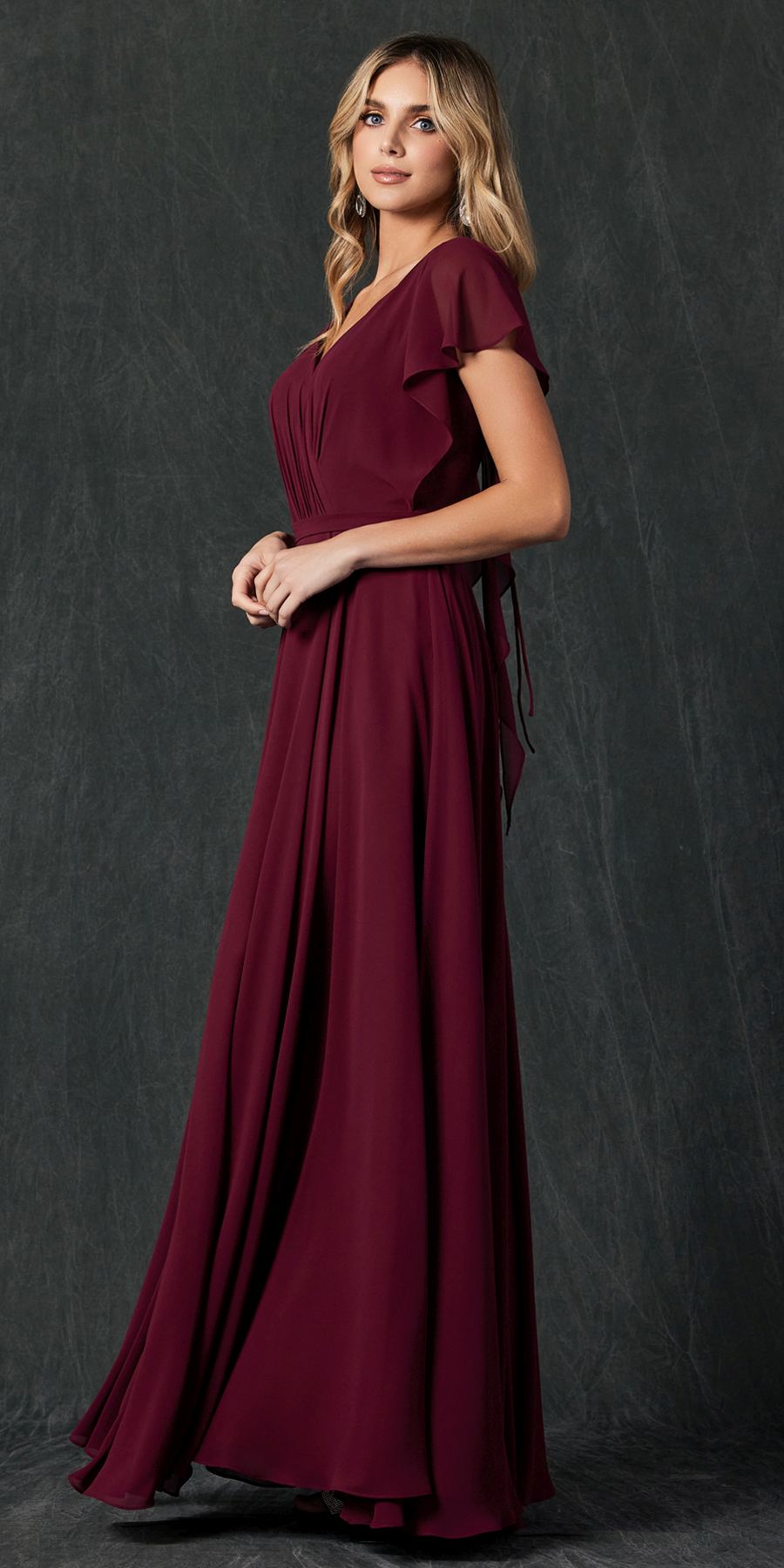 Burgundy formal dress with flutter sleeves and V-neck, draped bodice, flowing maxi skirt