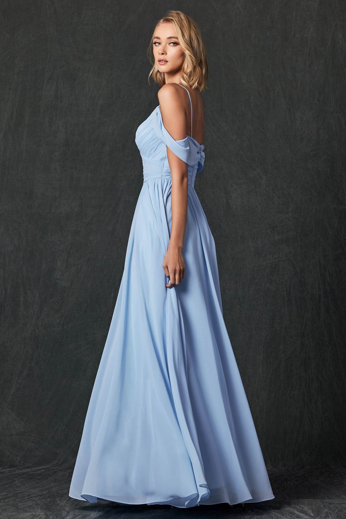 Ice blue pleated off-shoulder formal dress with draped sleeve detail and long skirt