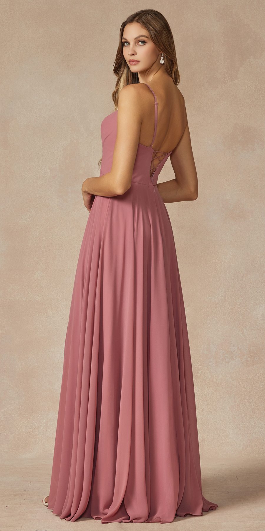 Spaghetti strap long formal dress in dusty rose with open back and flowing skirt