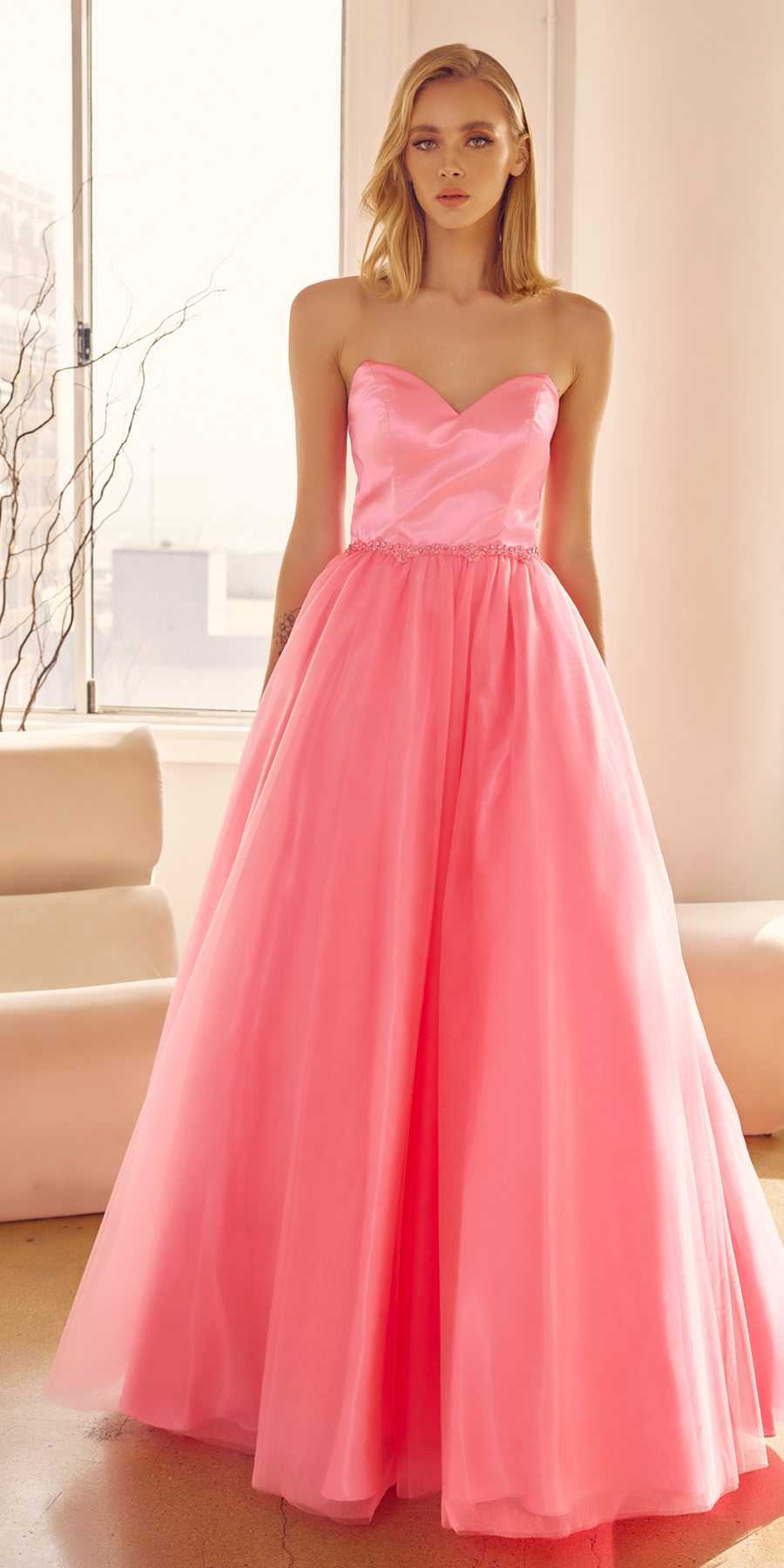 Hot pink strapless A-line ball gown with sweetheart bodice and beaded belt