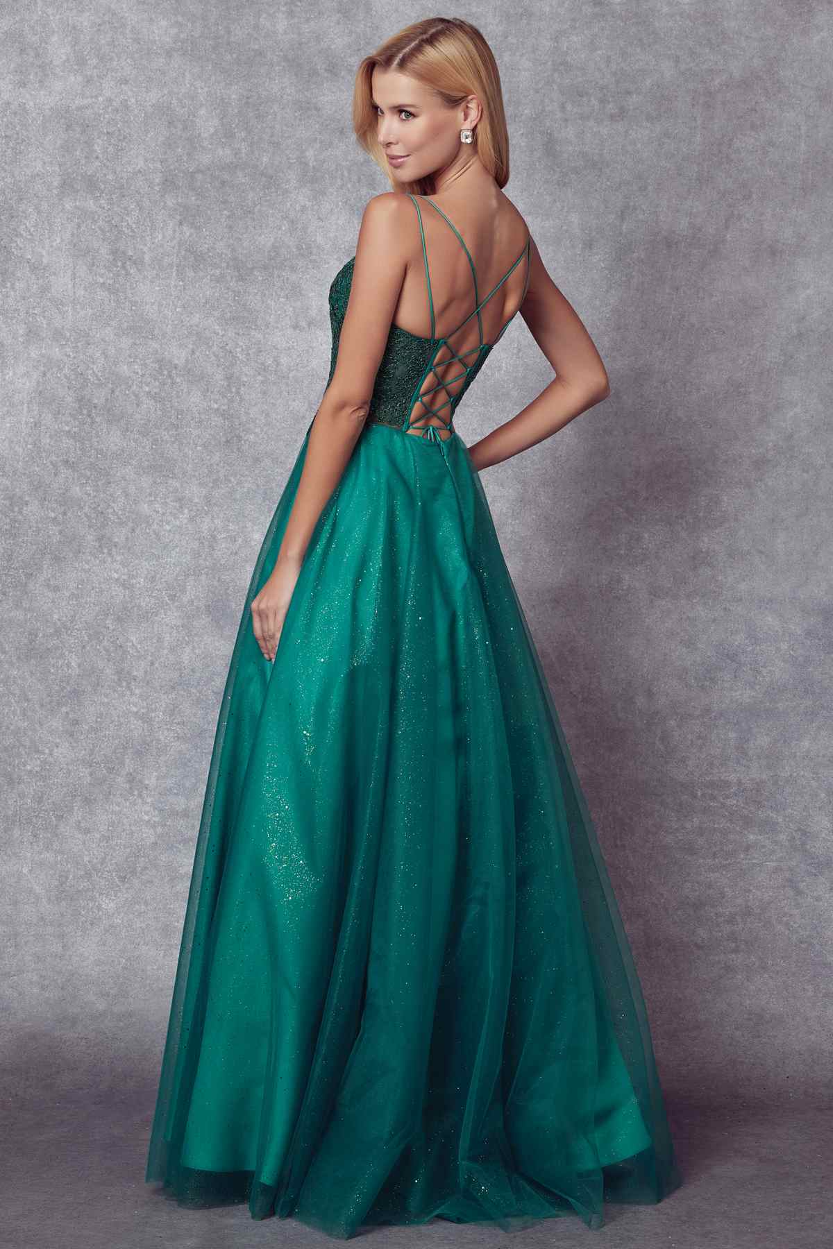Emerald green embroidered sparkle ball gown with crisscross open-back detail