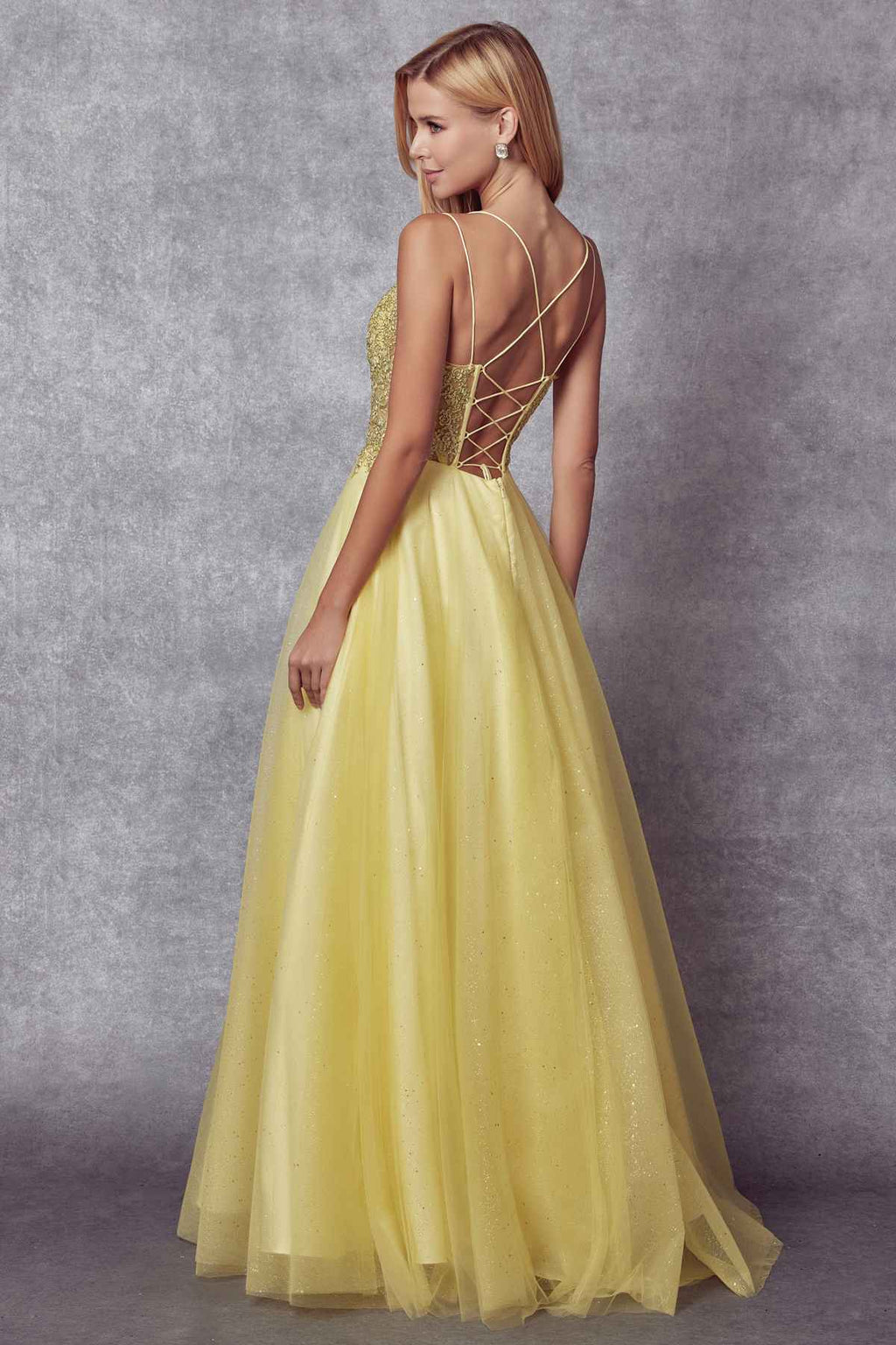 Yellow-gold sparkle tulle ball gown with back crisscross straps and full flared skirt