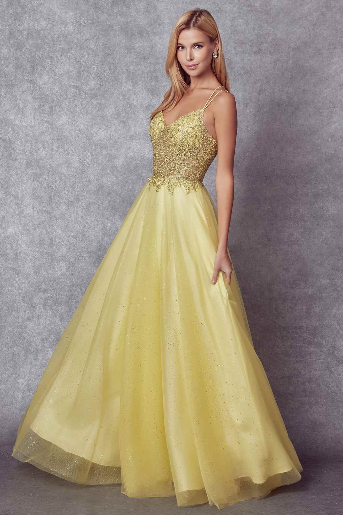 Yellow-gold sparkle tulle ball gown with fitted bodice, spaghetti straps, and full skirt