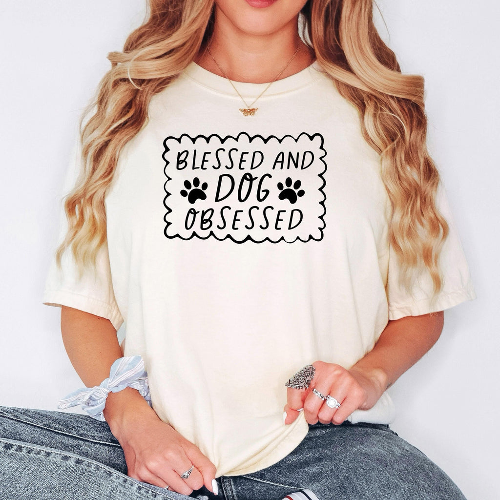 Ivory short-sleeve T-shirt with “Blessed and Dog Obsessed” paw print chest graphic