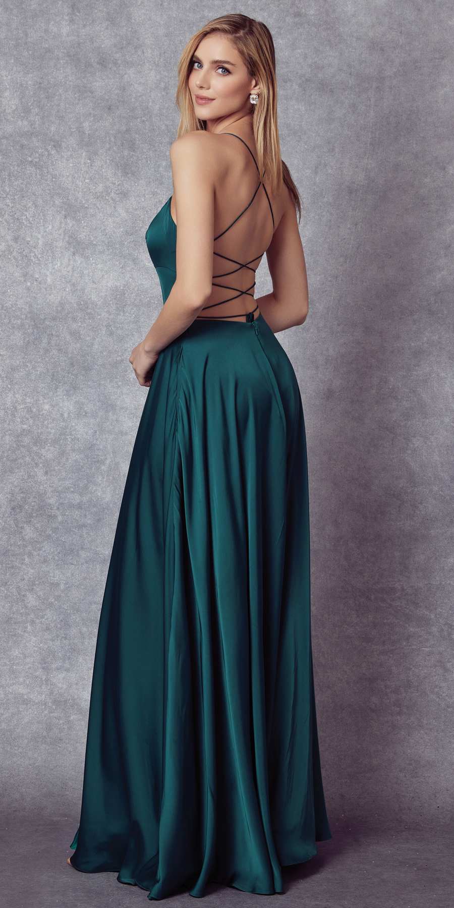 Dark green satin A-line gown with thin cross-back straps and flowing skirt