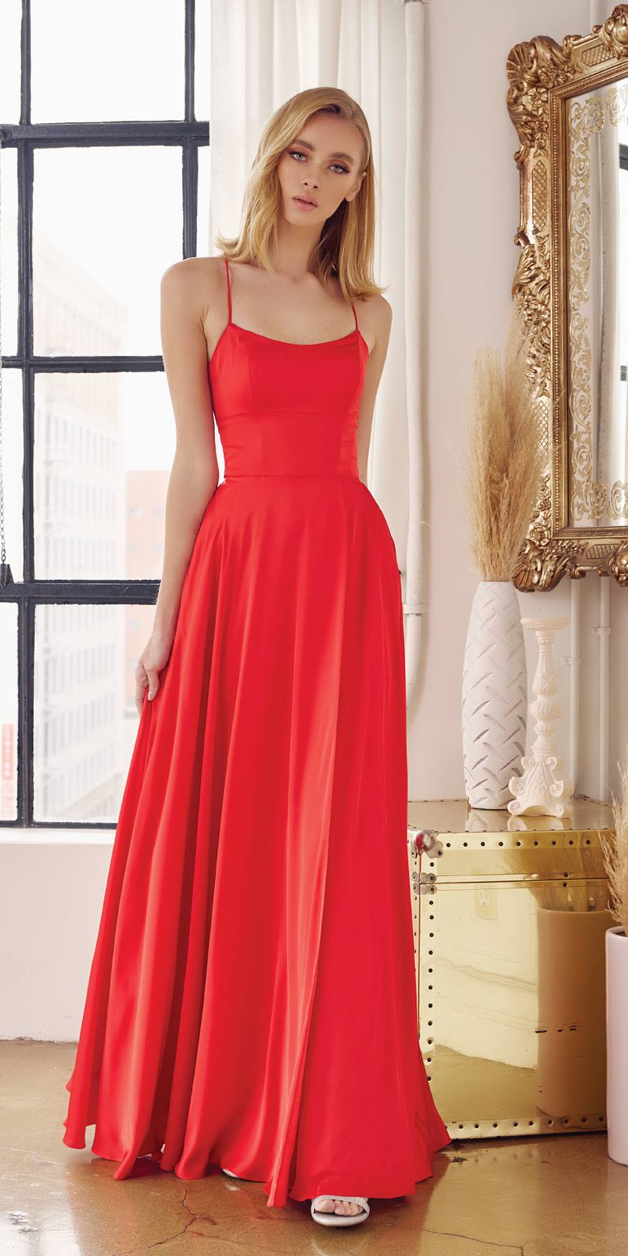 Red satin A-line formal gown with spaghetti straps and flared skirt