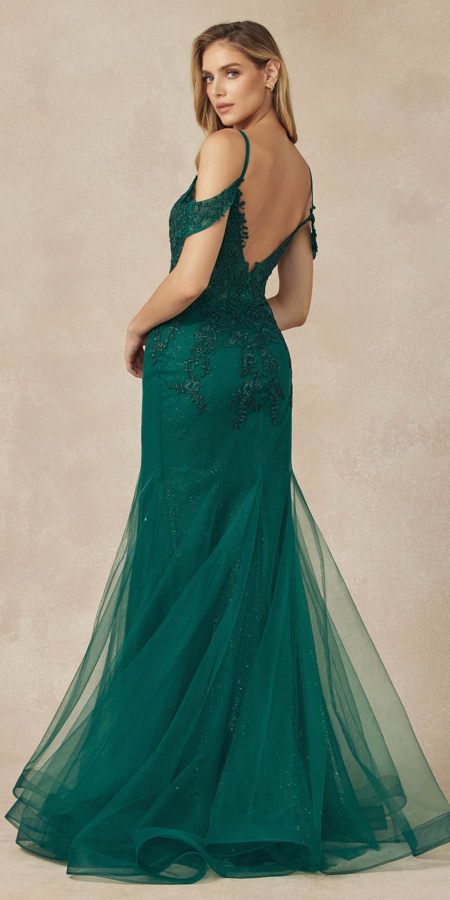 Emerald green mesh mermaid gown with open-back straps and flared sheer skirt