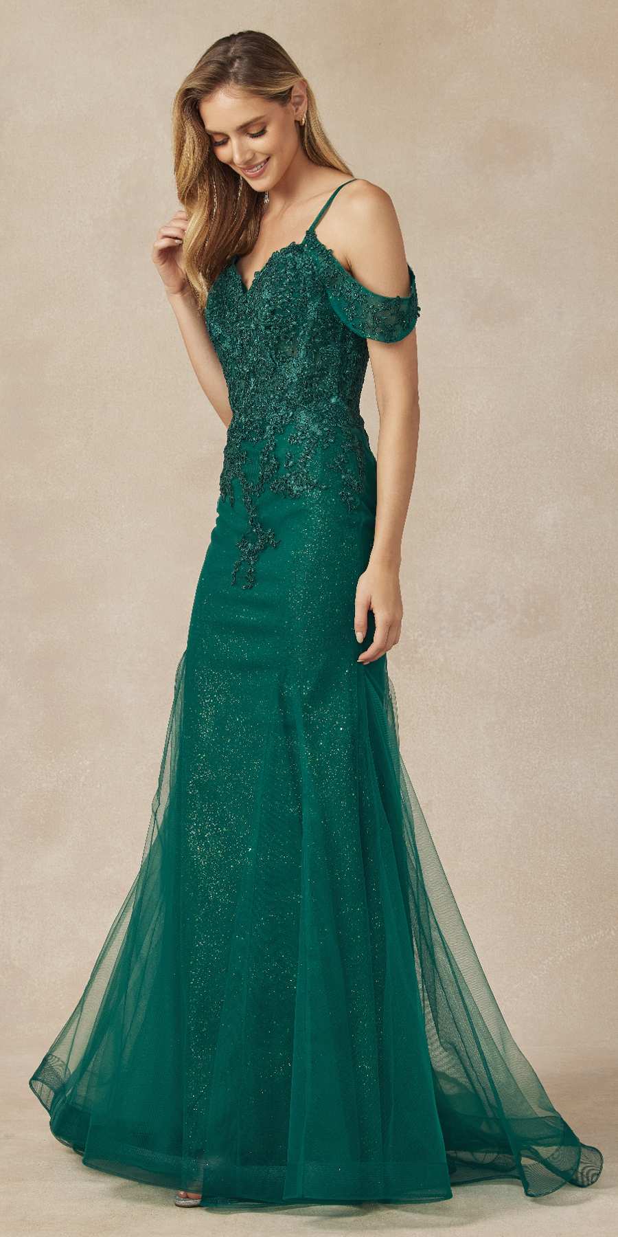 Emerald green mesh mermaid gown with off-shoulder sleeves, lace bodice, and flared skirt