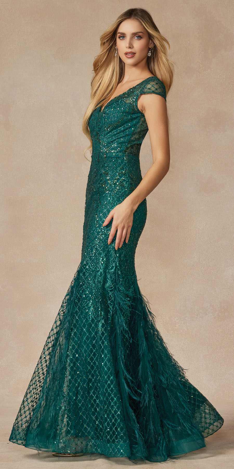 Emerald green fitted prom dress with V-neck, cap sleeves, and flared sequined mermaid skirt