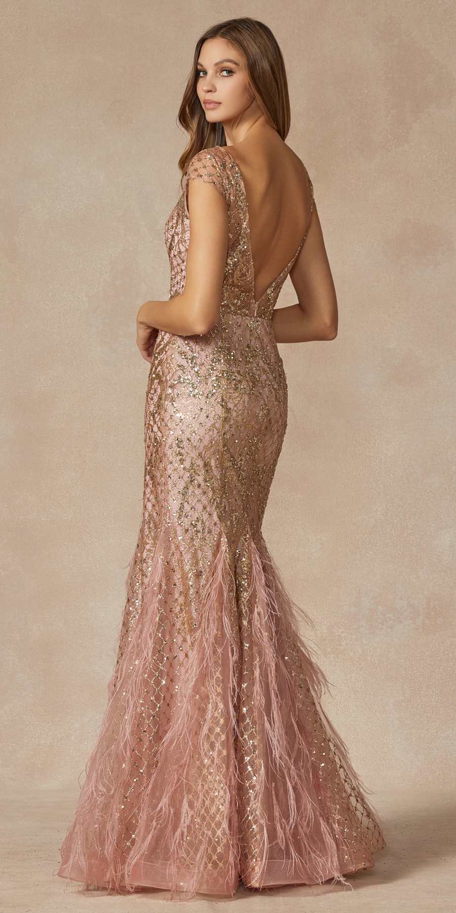 Rose gold sequined prom dress with open back, cap sleeves, and feathered floor-length hem