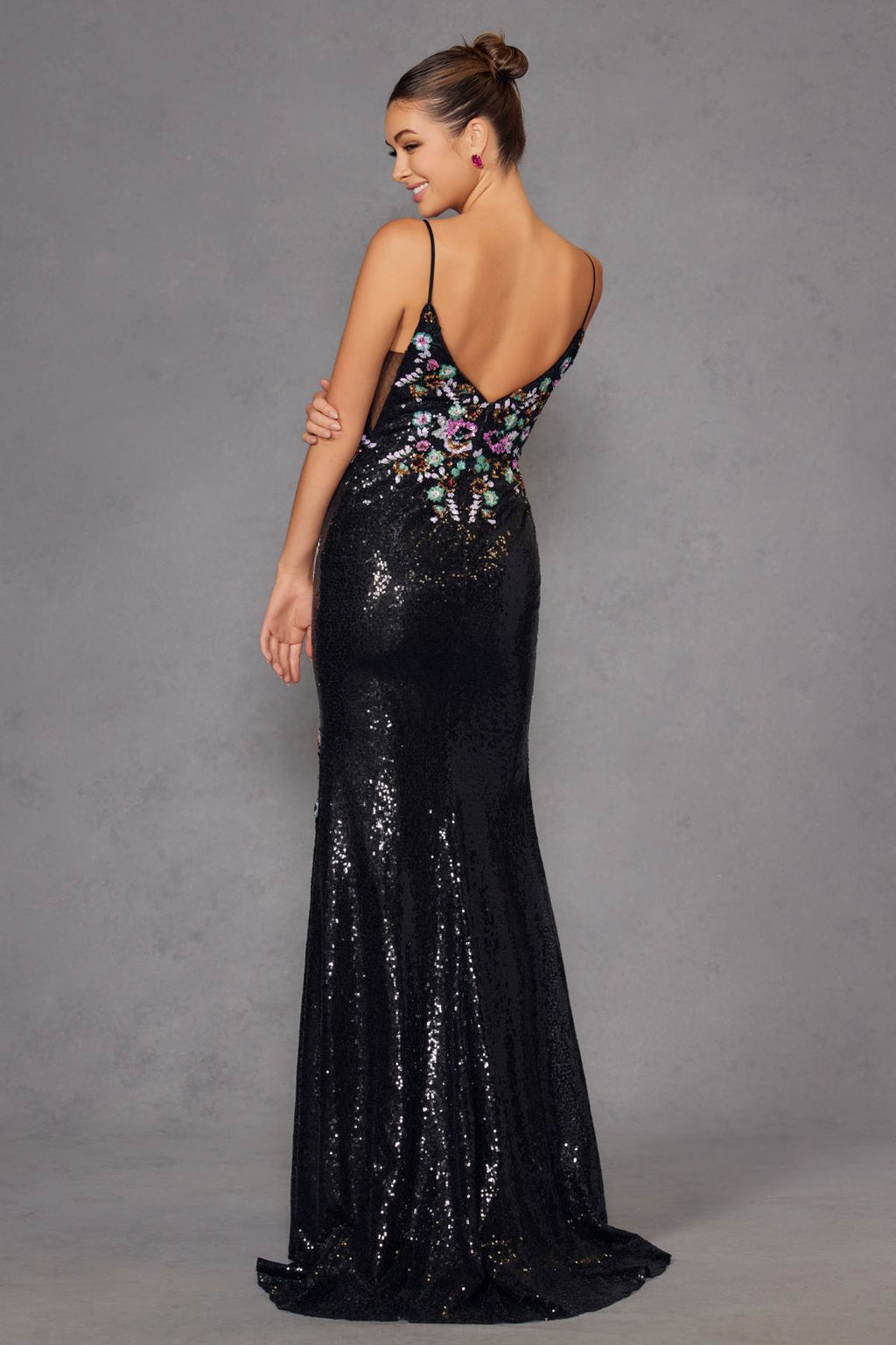 Black sequin prom gown with floral embroidery, open back, spaghetti straps, full length.
