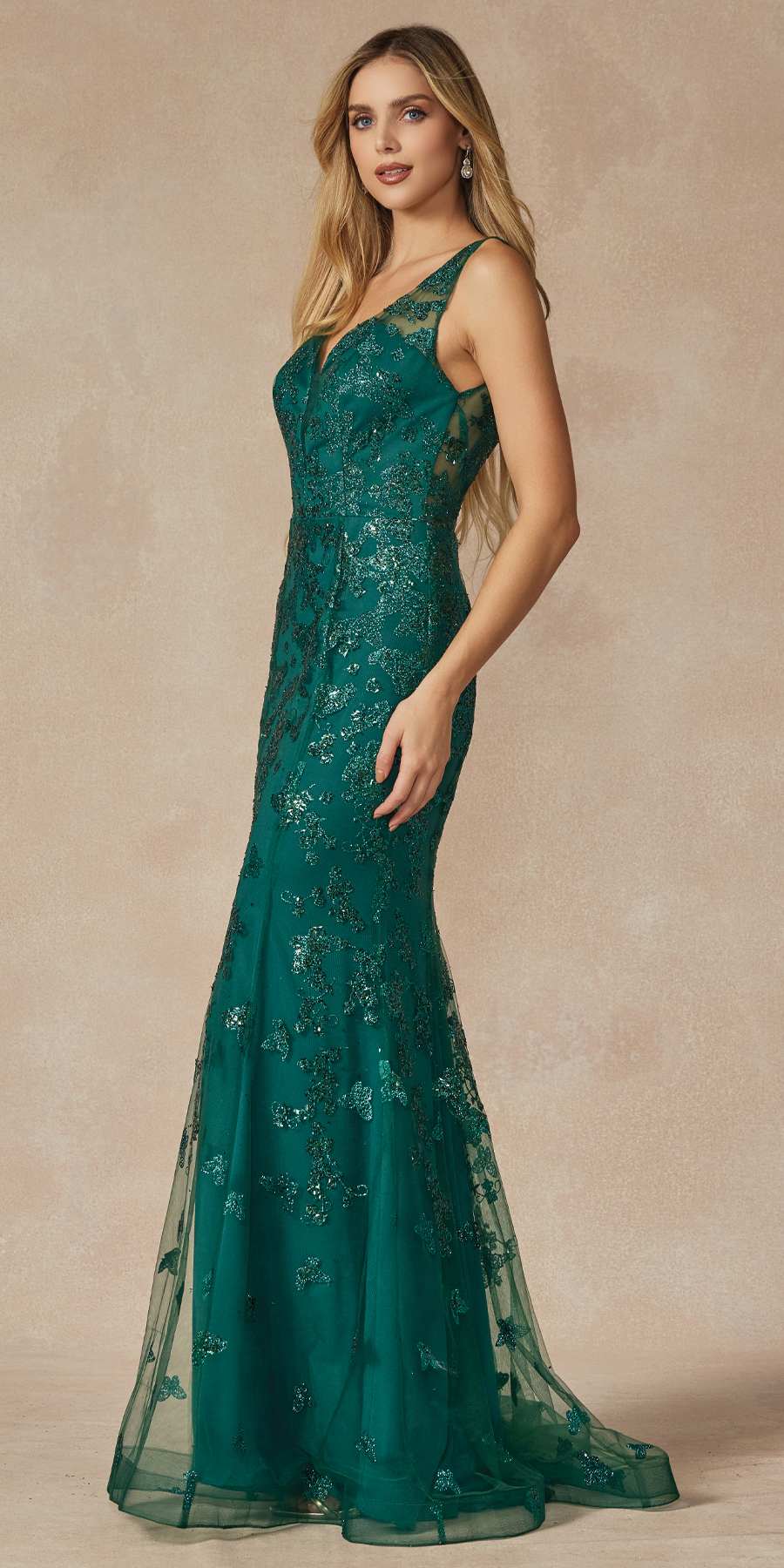 Emerald green long prom dress with low V-neck and fitted mermaid skirt with appliqués