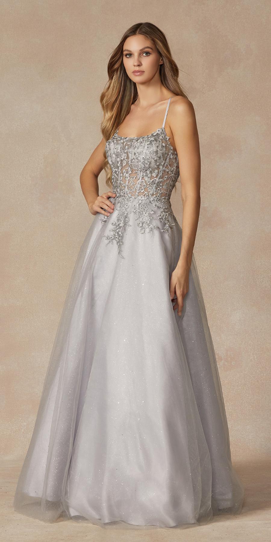 Silver leaf lace corset-style prom gown with spaghetti straps and floor-length skirt.