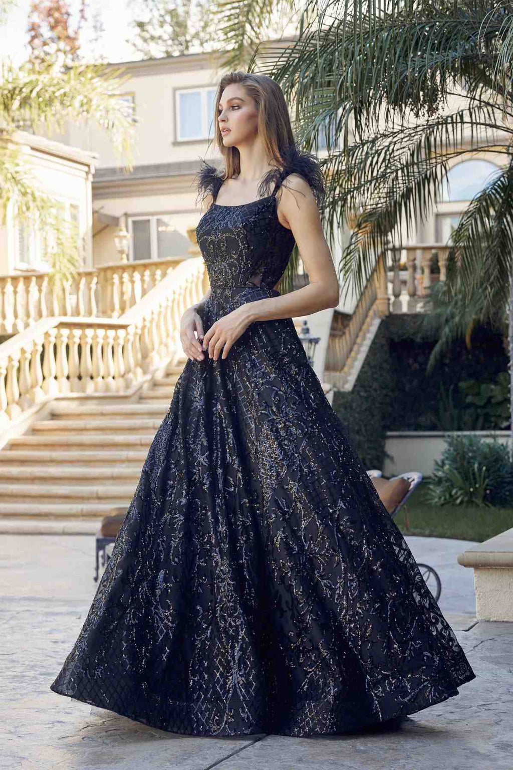 Black sequined A-line floor-length gown with cap sleeves and feathered neckline trim