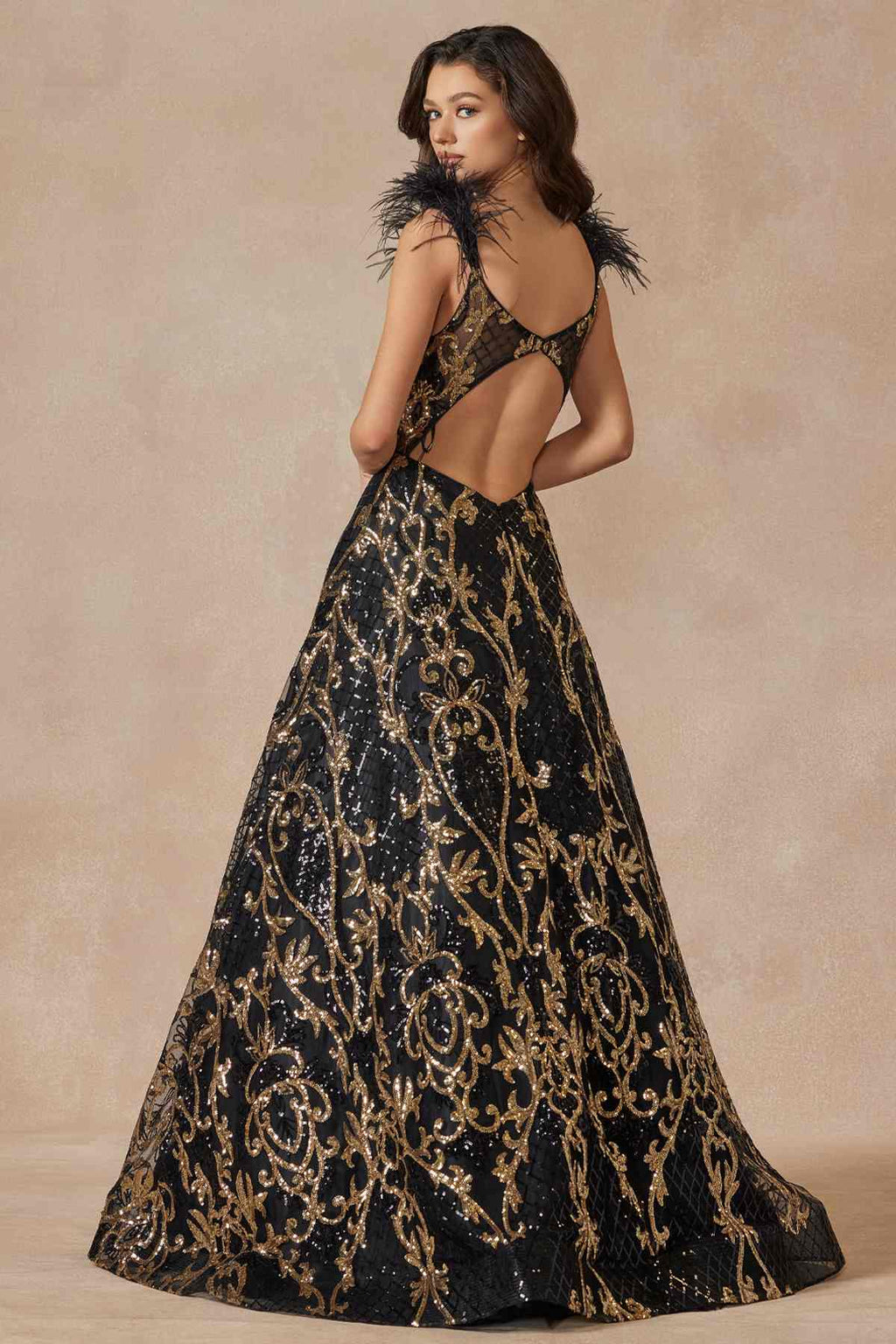 Black and gold sequined A-line floor-length gown with feathered shoulder accents