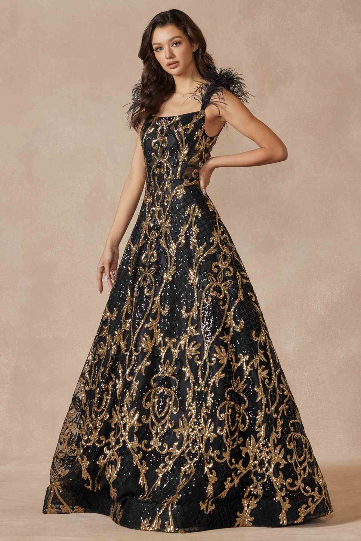 Black and gold sequin A-line gown with feathered cap sleeves and patterned skirt