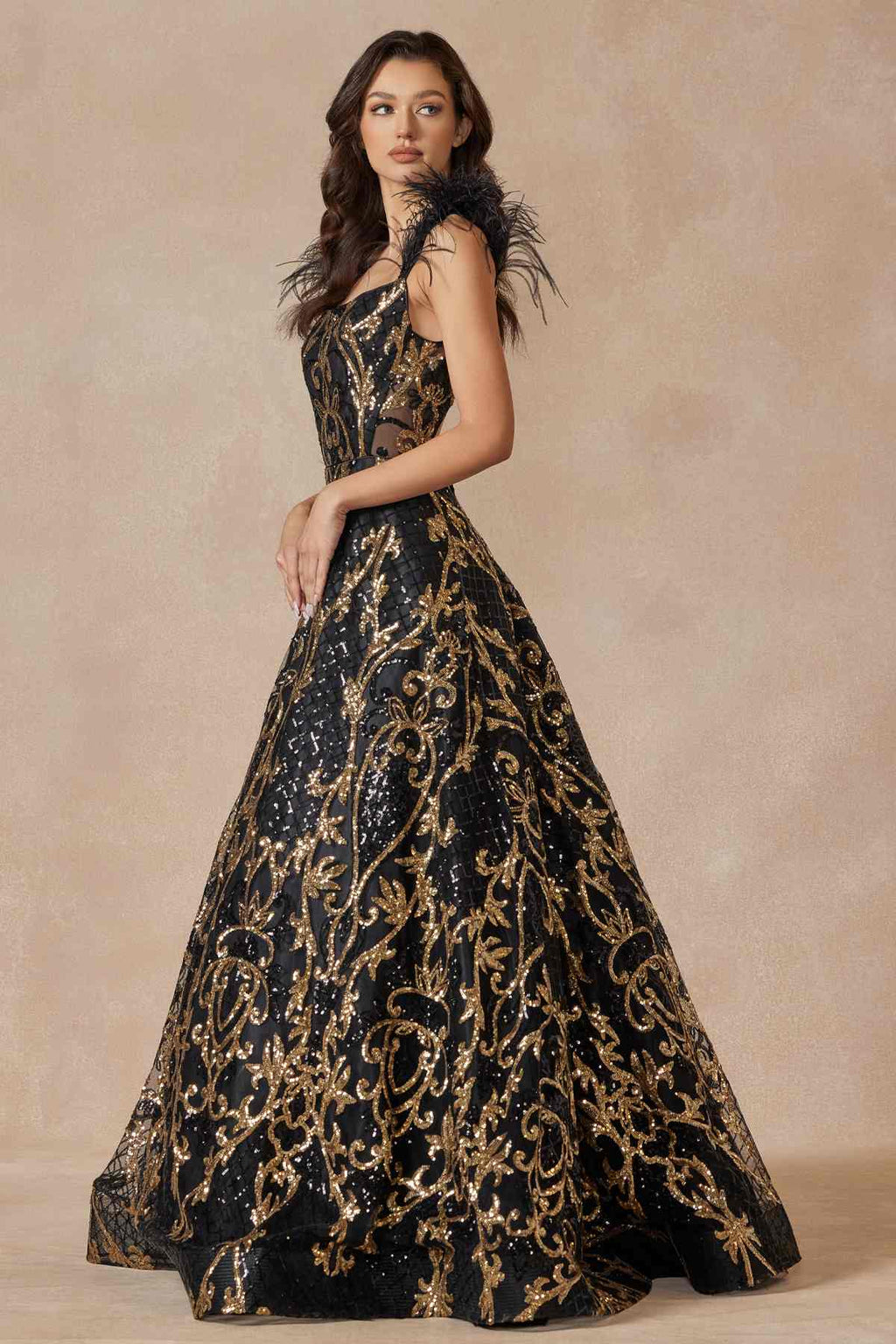 Black and gold sequin A-line gown with feathered cap sleeves, floor length
