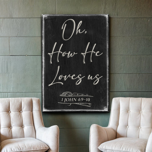 Black faith sign with white script verse and '1 John 4:9-10' in a frame.