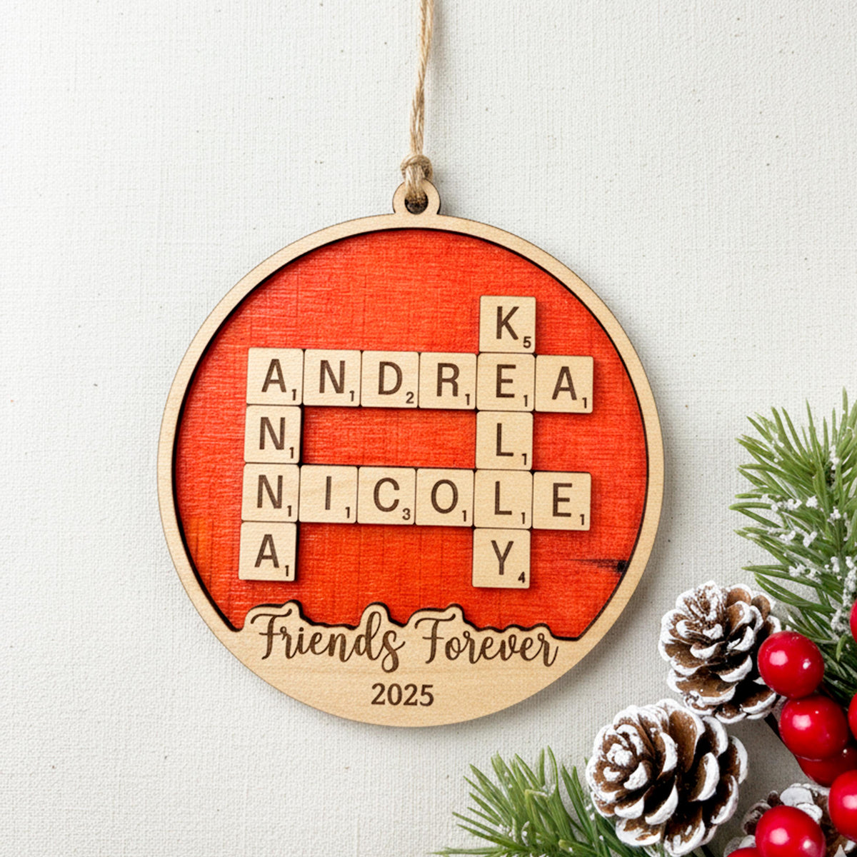 Red wooden round ornament with engraved blocks, “Friends Forever” and “2025,” hanging cord