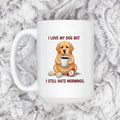 White ceramic dog lover mug with dog holding coffee; text: I love my dog but I still hate mornings.