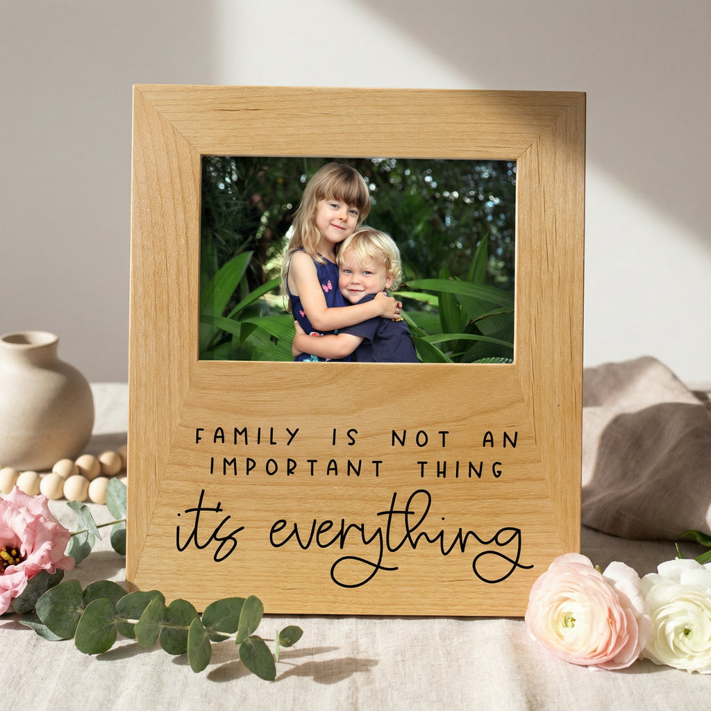 Natural wood photo frame with inner photo and 'Family is not an important thing' quote