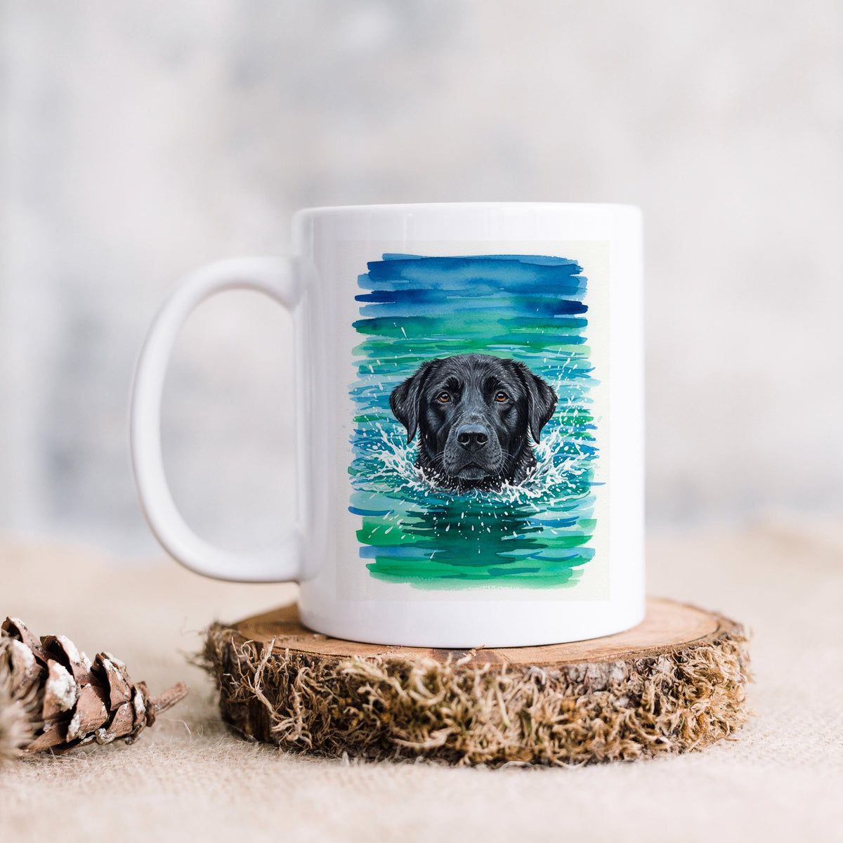 White ceramic coffee mug with watercolor black lab portrait and blue-green splash