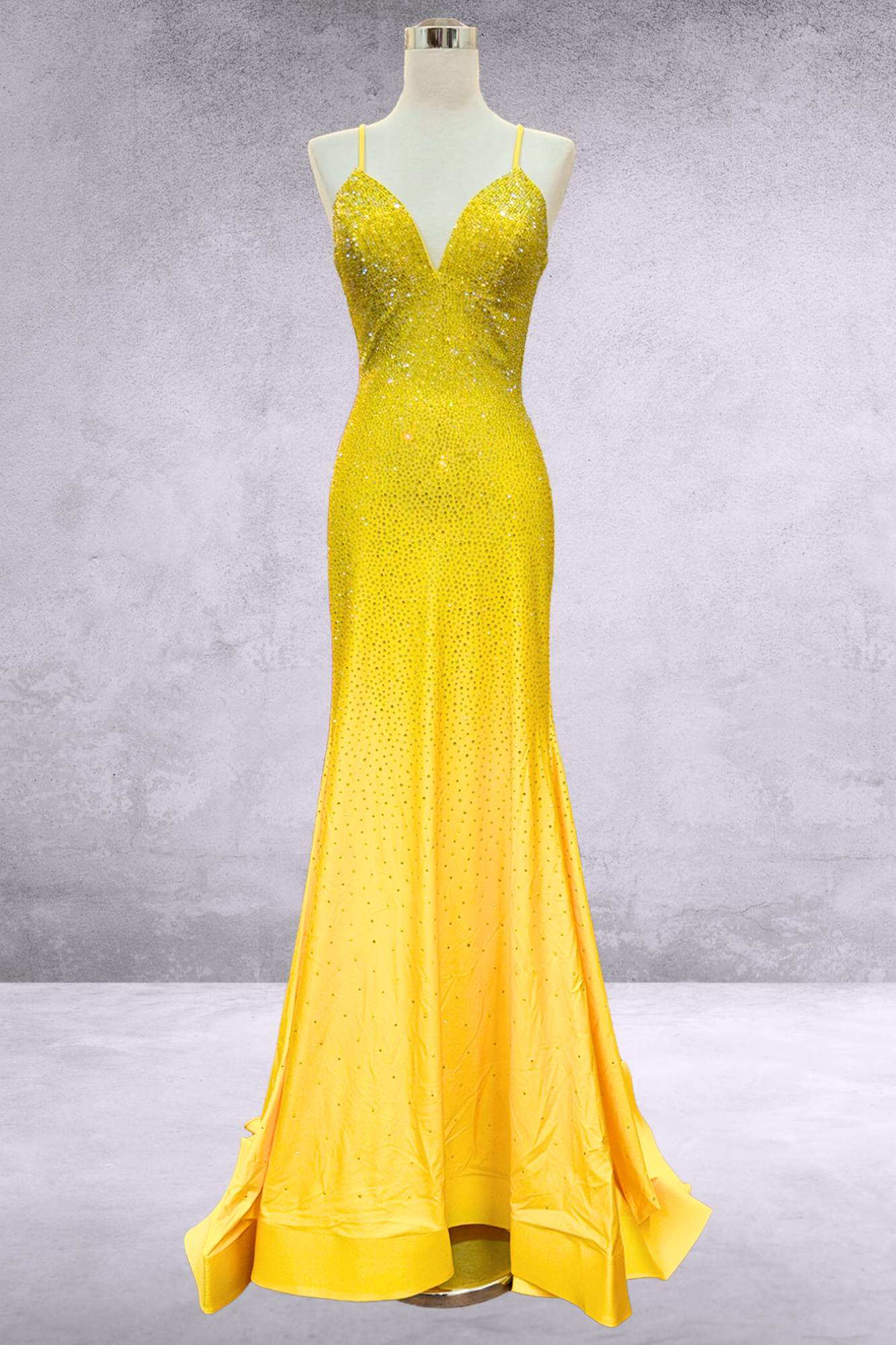 Sequined mermaid gown with V-neck, spaghetti straps, and flared hem in yellow
