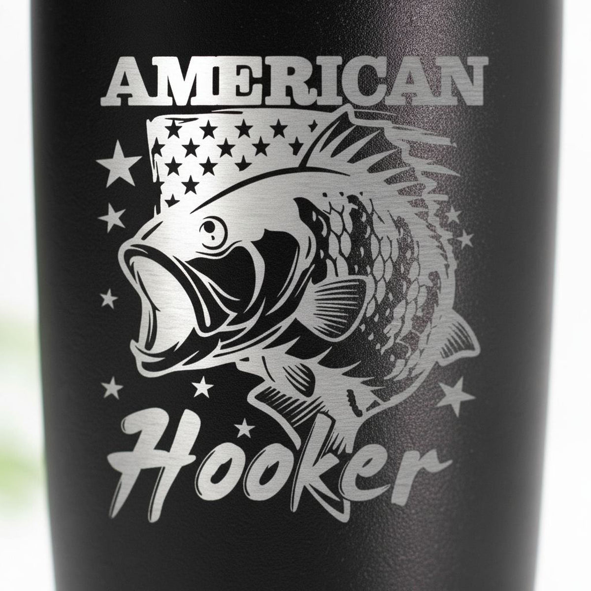 Black insulated tumbler with spill-resistant lid featuring American Hooker fish logo