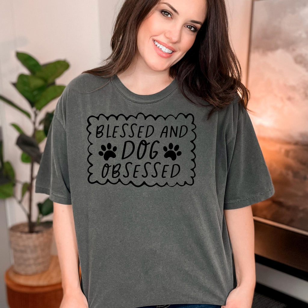 Dark gray short-sleeve T-shirt with “Blessed and Dog Obsessed” paw print chest graphic