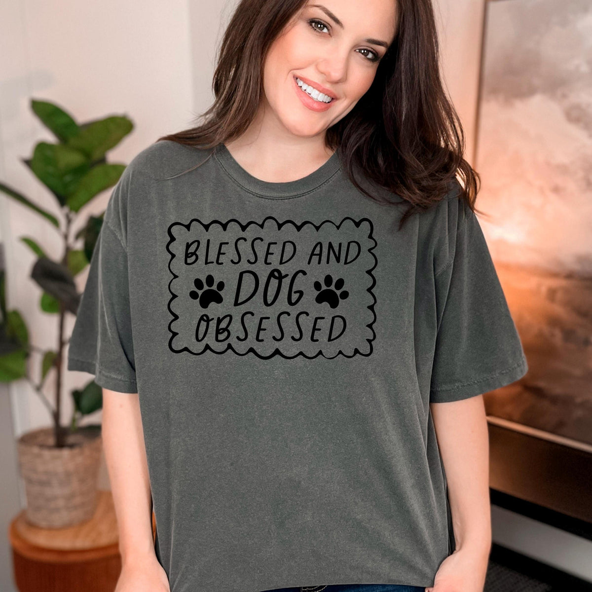 Dark gray short-sleeve T-shirt with “Blessed and Dog Obsessed” paw print chest graphic