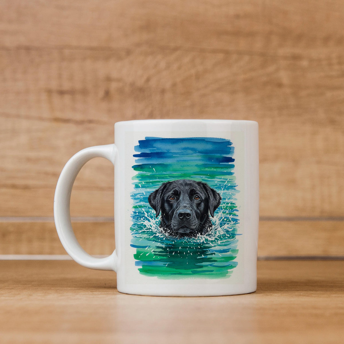 White ceramic coffee mug with watercolor black lab in blue-green water splash art