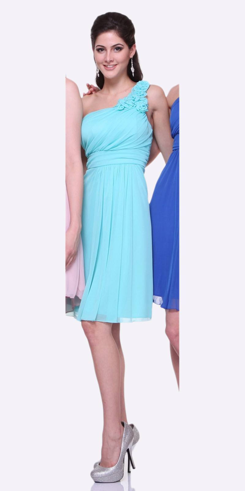 One-shoulder chiffon dress in light blue with ruffle detail and gathered waist, knee-length.