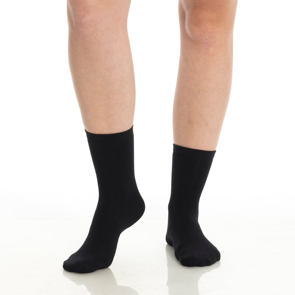 Bamboo crew socks 3-pack in black on legs, crew height, smooth knit