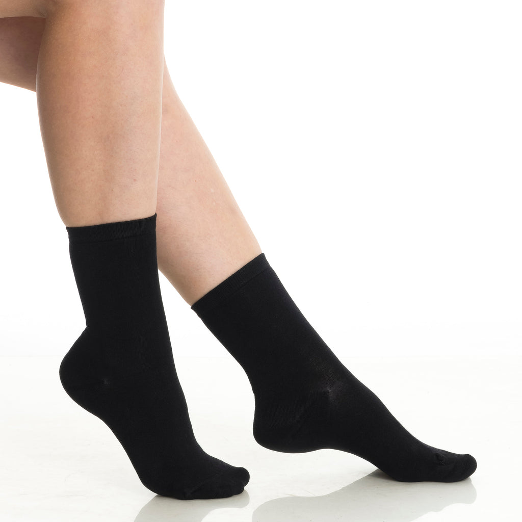 Bamboo crew socks 3-pack in black on feet, crew height with smooth knit