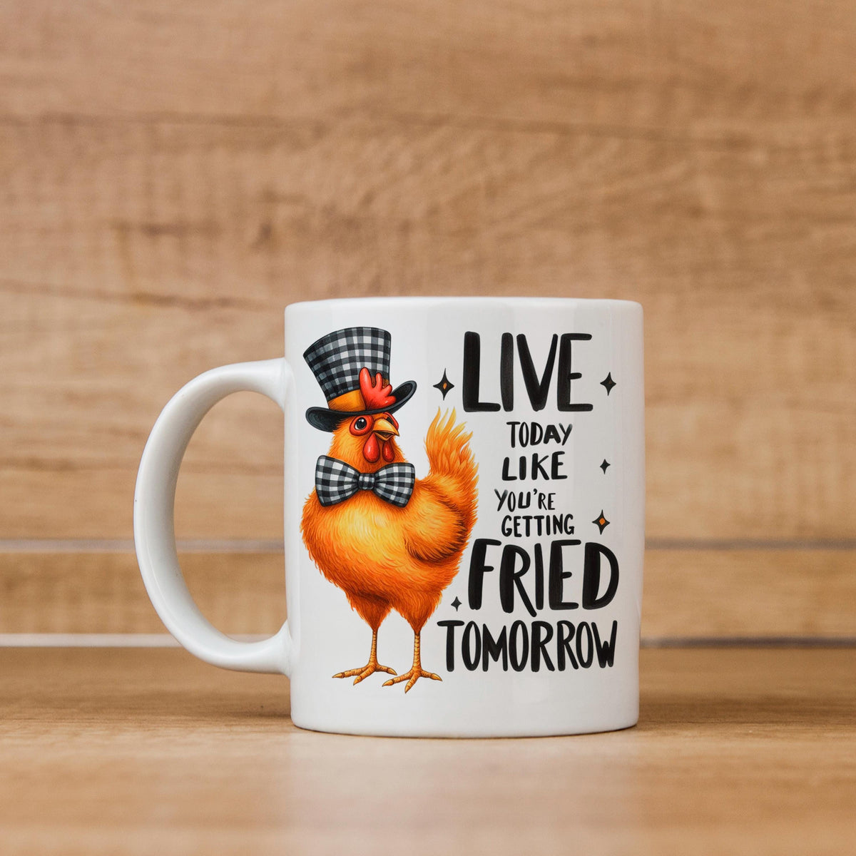 White ceramic mug with orange cartoon chicken wearing hat and LIVE…FRIED TOMORROW slogan