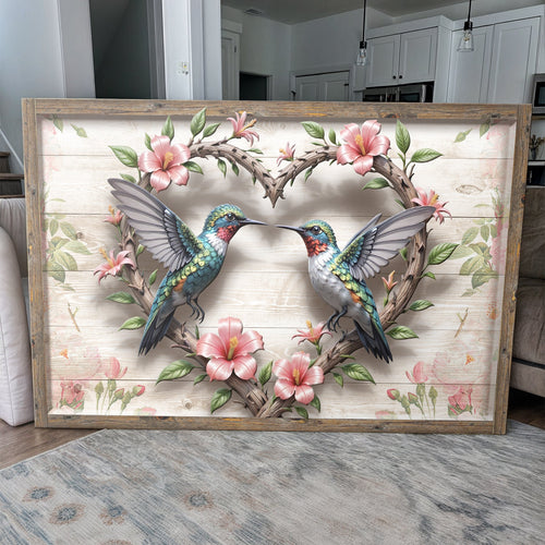 Framed wall art with two colorful hummingbirds perched on a flowering branch