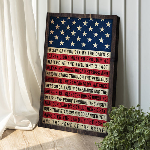 Framed American flag wall art with patriotic text and red-and-white stripes
