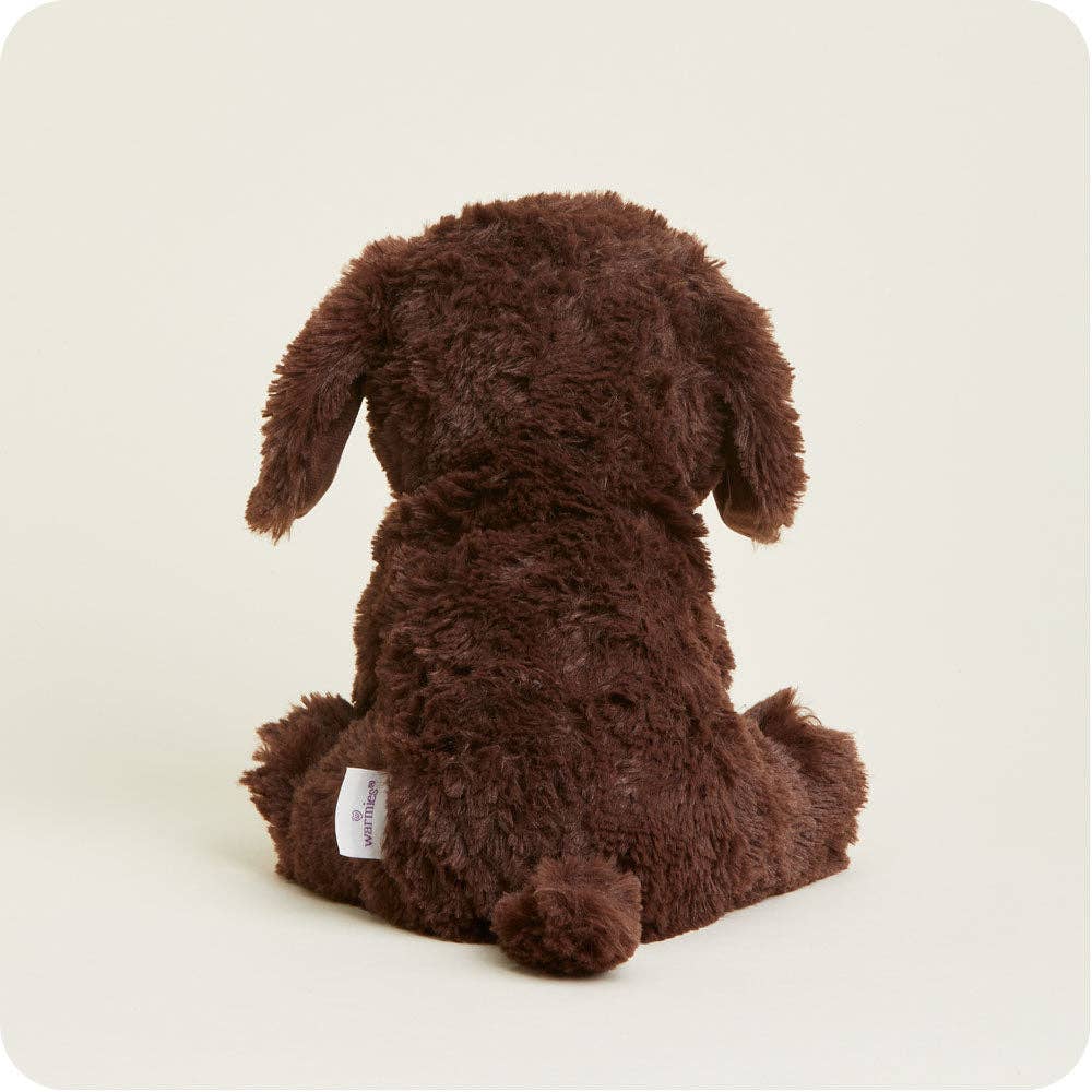 Chocolate brown plush labrador dog viewed from behind, sitting