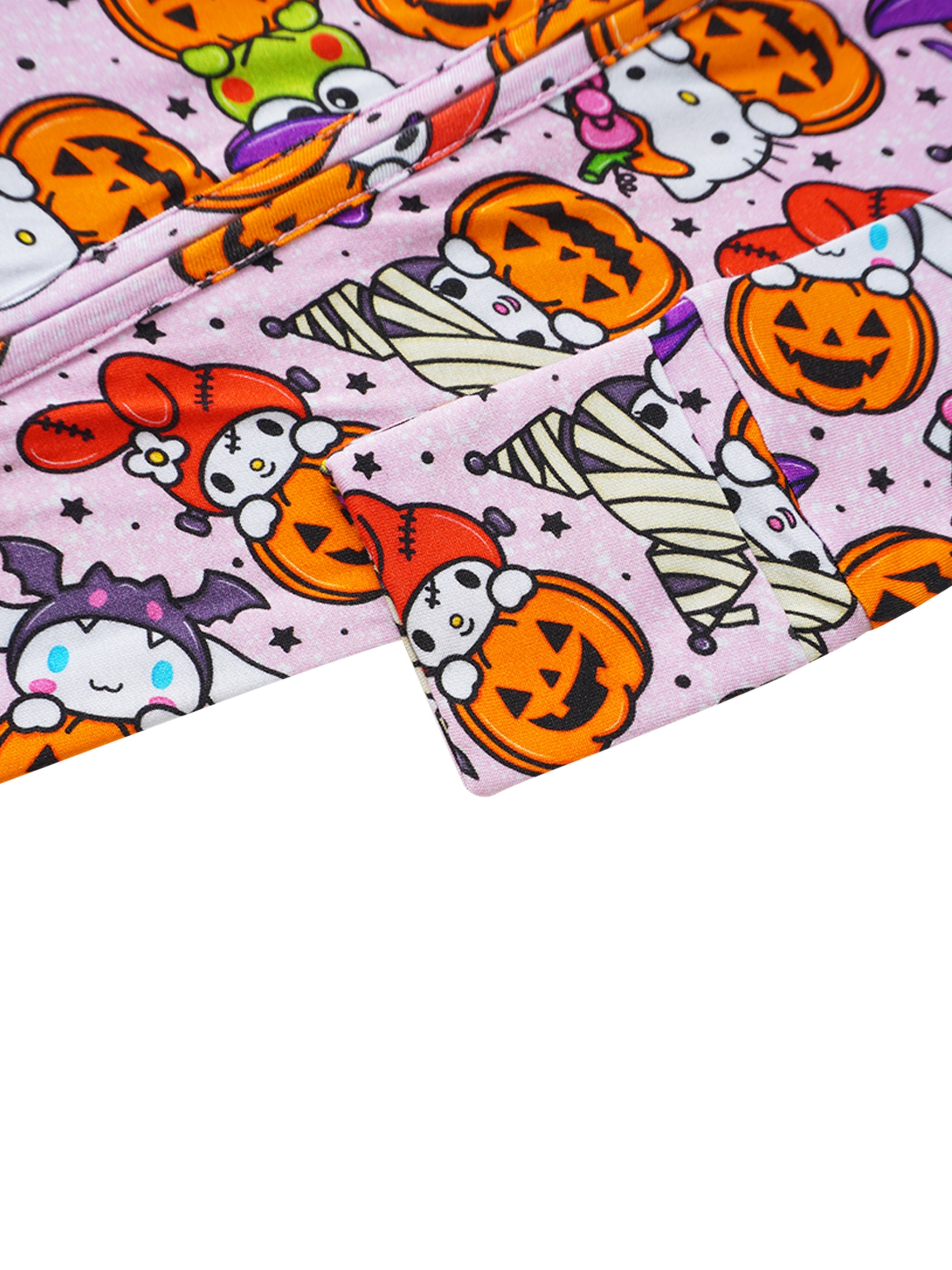 Baby romper sleeve and leg fabric close-up, light lavender with orange pumpkin print