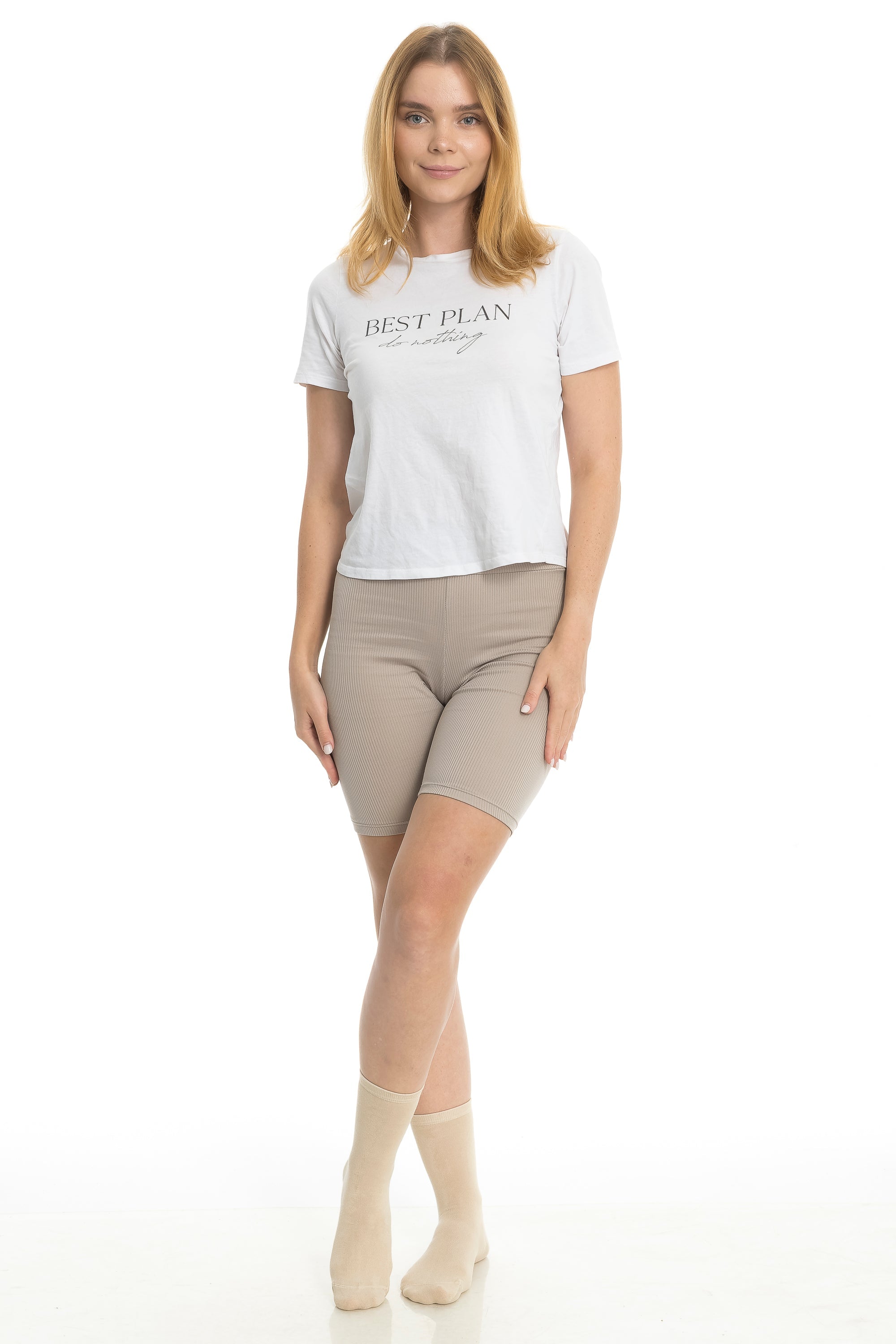 Women’s bamboo crew socks in beige on model, mid-calf length with ribbed cuff