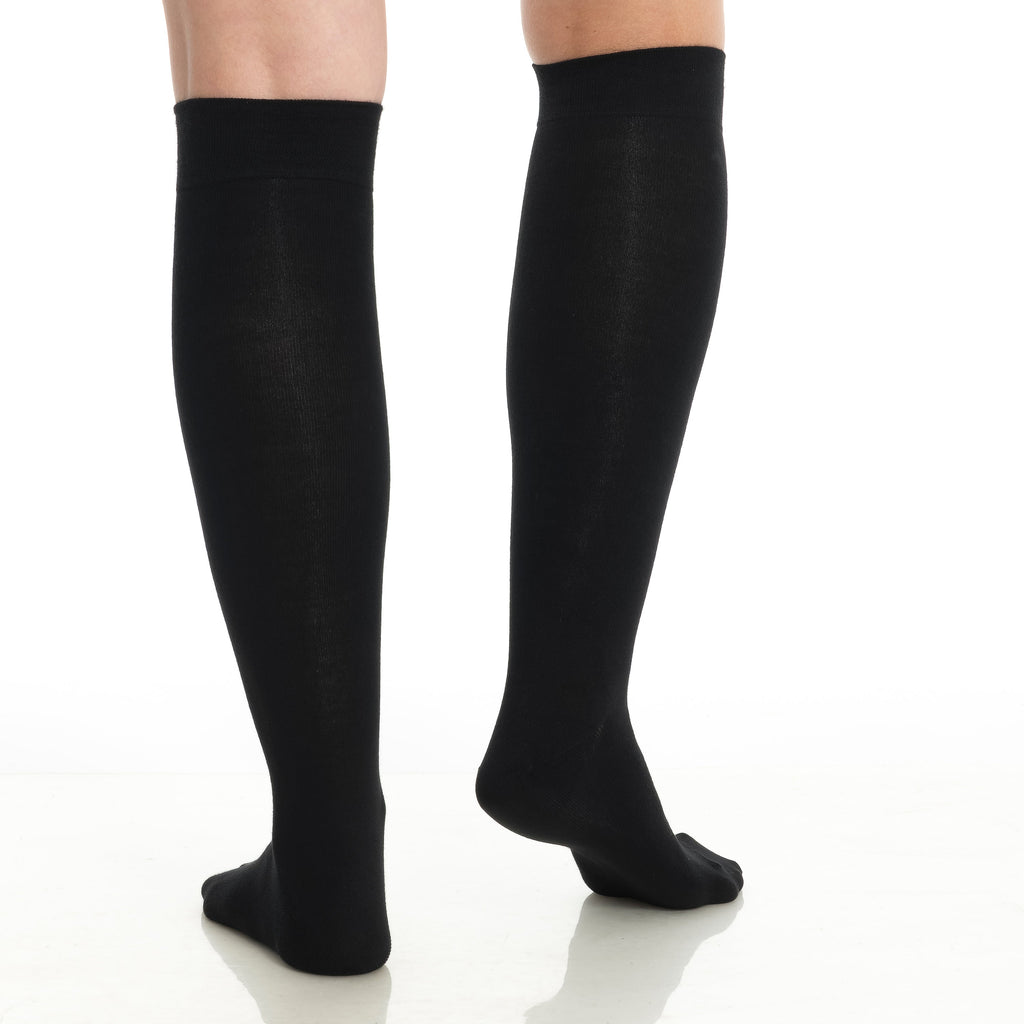 Black knee-high socks on legs, full length view