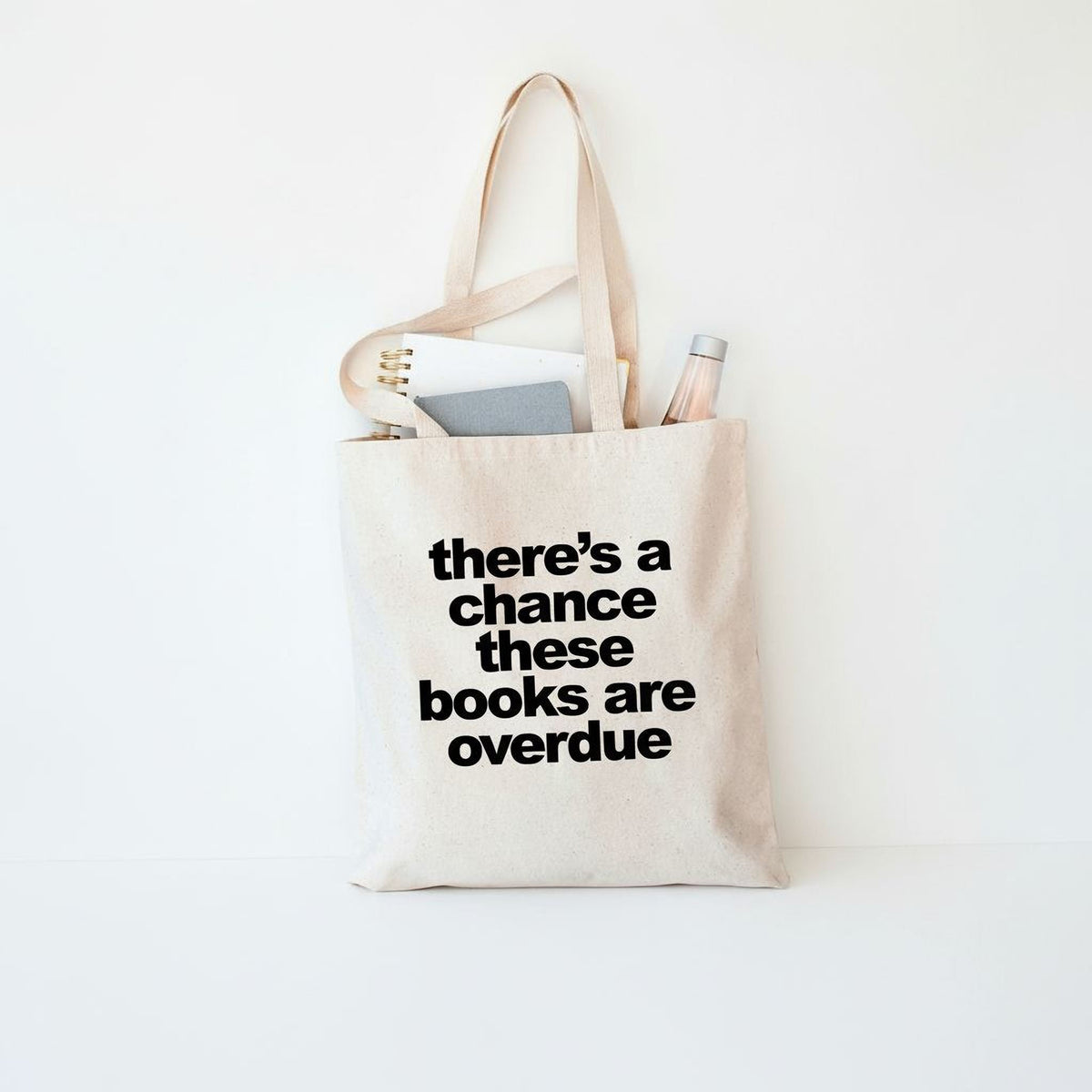 Canvas tote bag with printed text: there's a chance these books are overdue