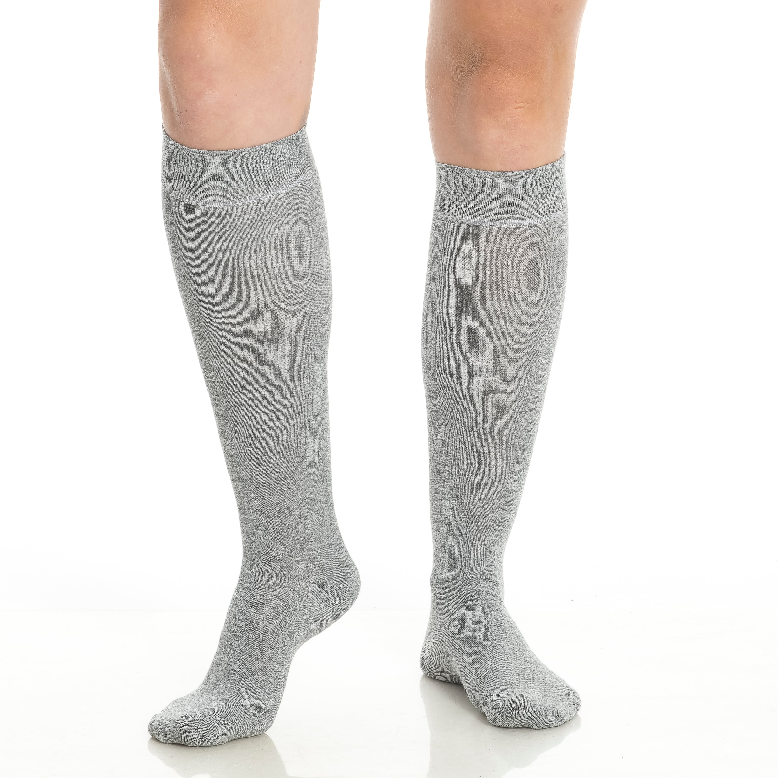 Close-up of gray knee-high socks on legs with soft cuff