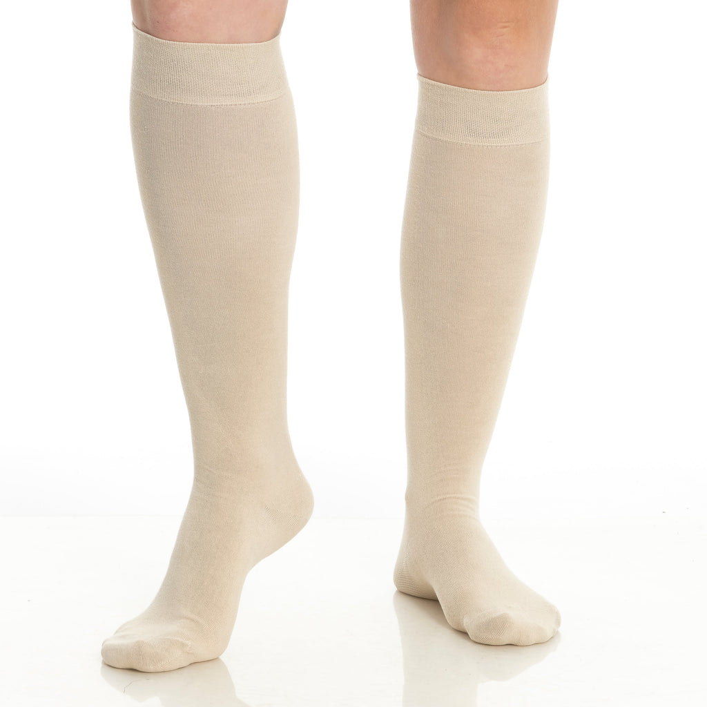 Women’s bamboo knee-high socks in beige/cream, two pairs shown on legs