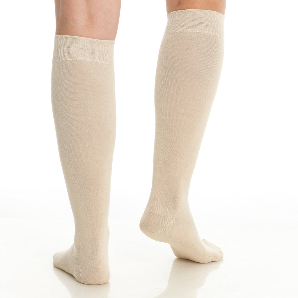 Women’s bamboo knee-high socks in beige/cream, full-length on two legs