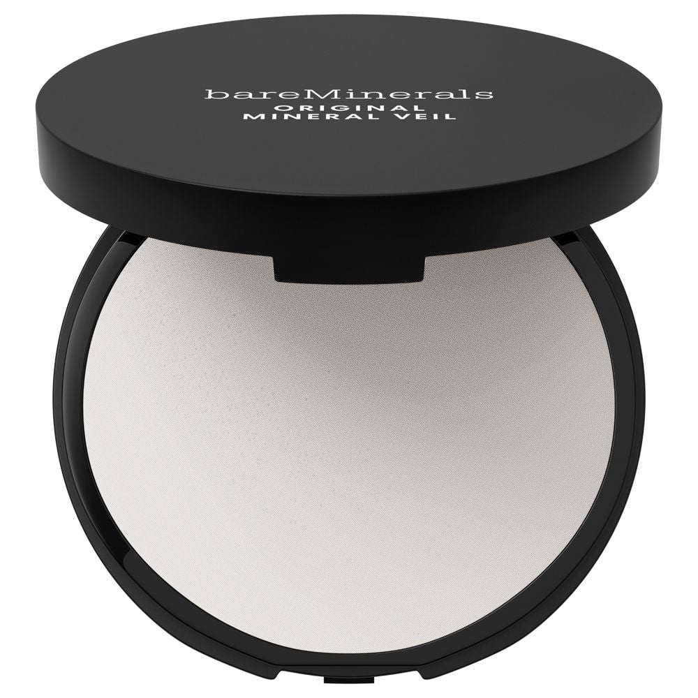Pressed setting powder compact, pale white pressed powder with open lid