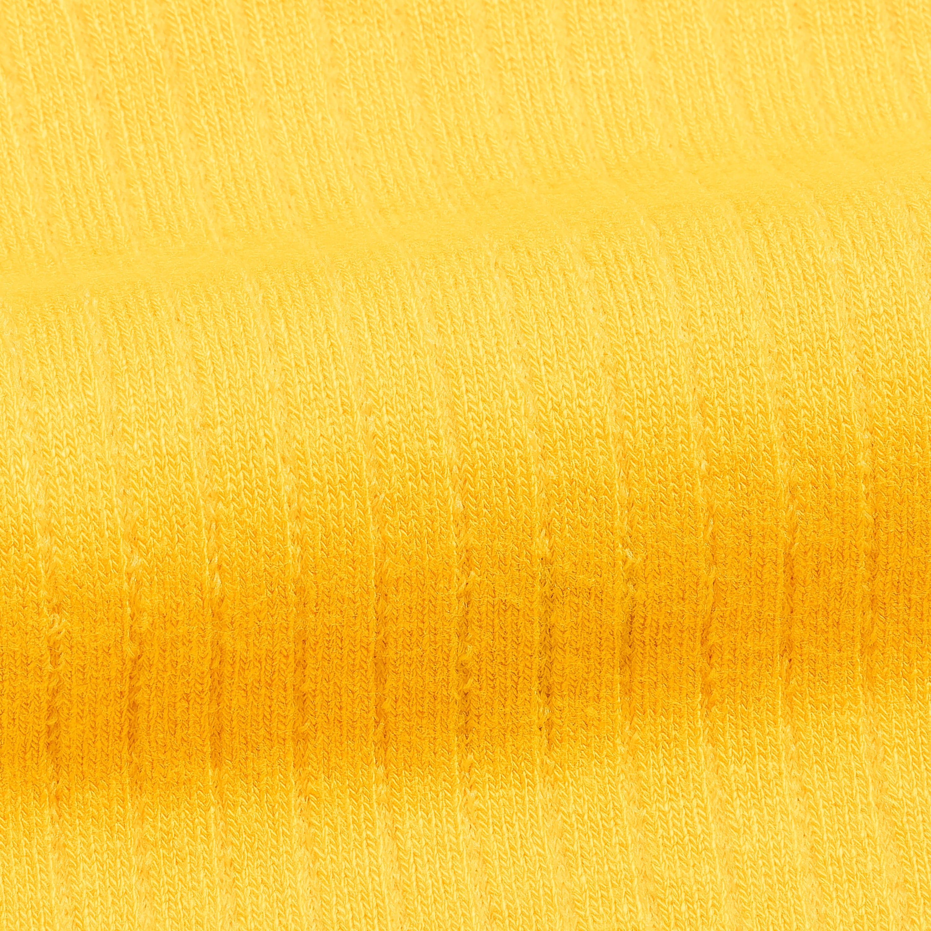 Men's bamboo dress socks fabric, yellow knit texture close-up
