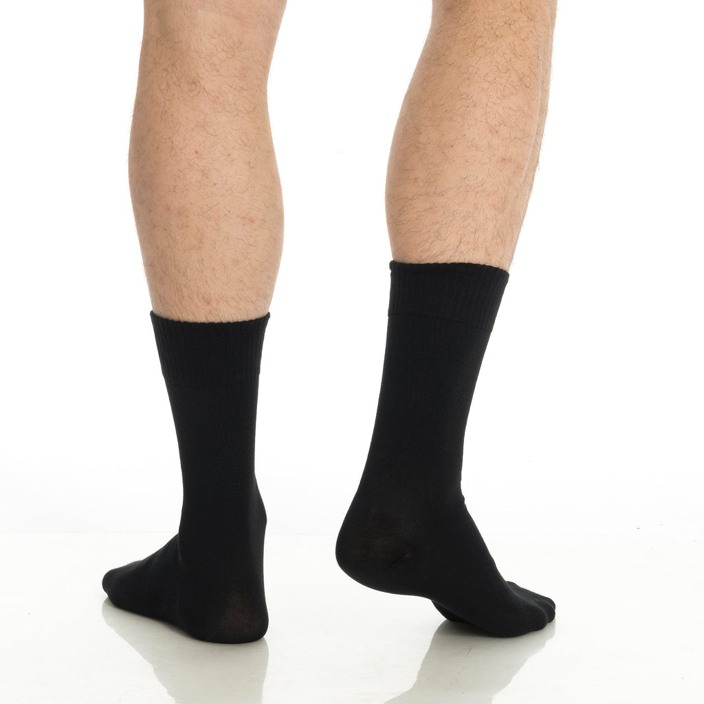 Black bamboo diabetic crew socks on feet, full lower-leg view, crew length.