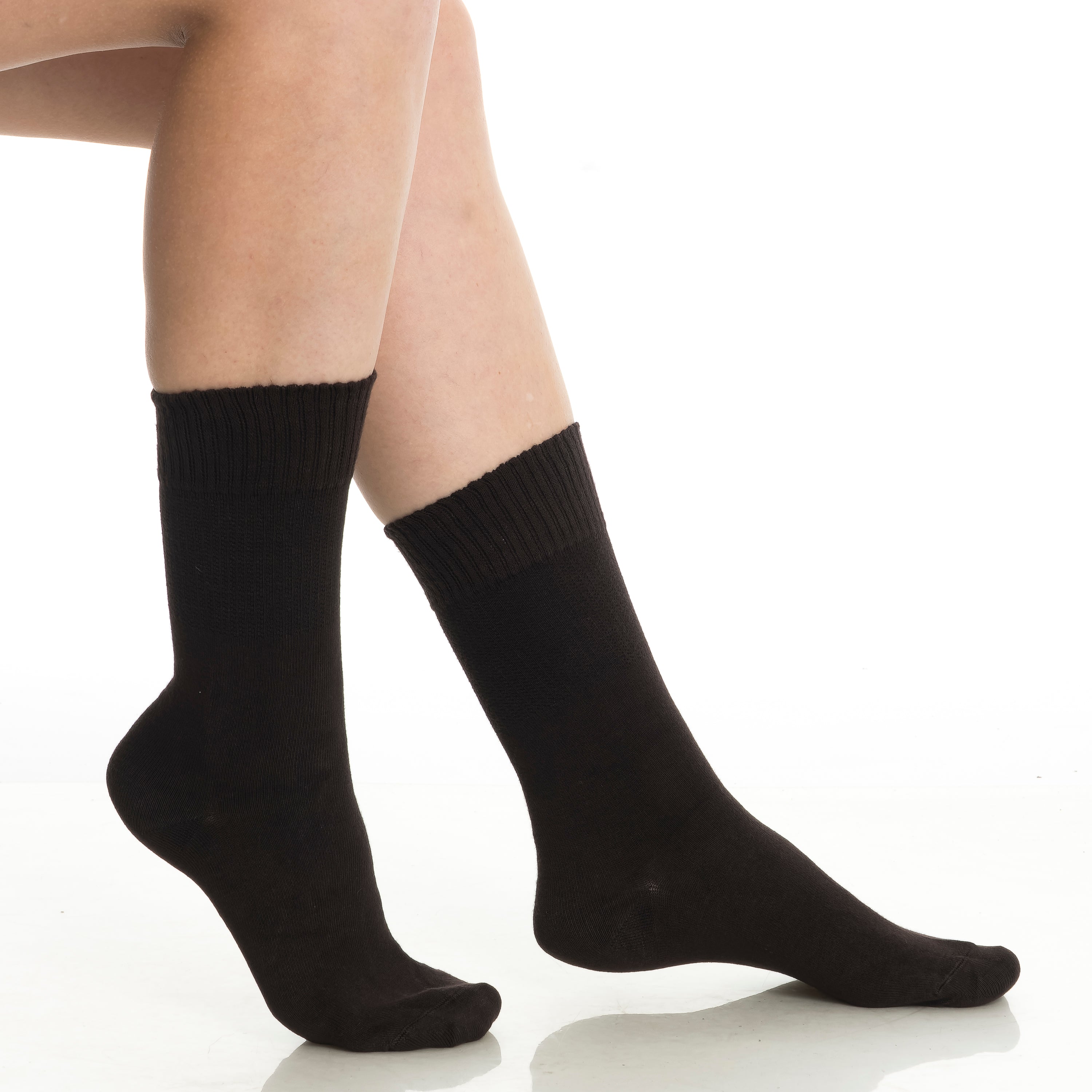 Black diabetic crew socks close-up, side view on two feet